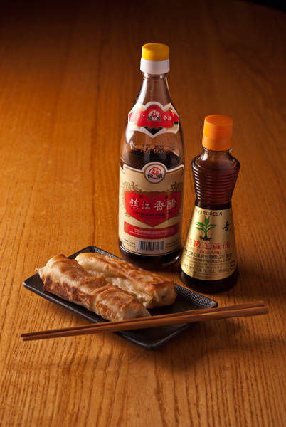 Spring Rolls, vinegar, sesame oil and chopsticks