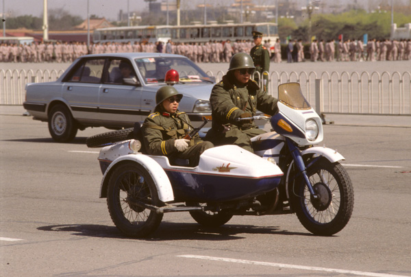Armed police patrol a year after Tiananmen crackdown, Beijing