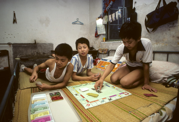 Students play Monopoly at acrobat school, Beijing