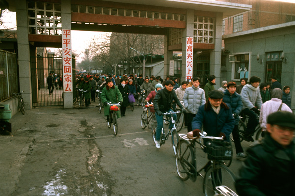 Workers leave factory, Beijing