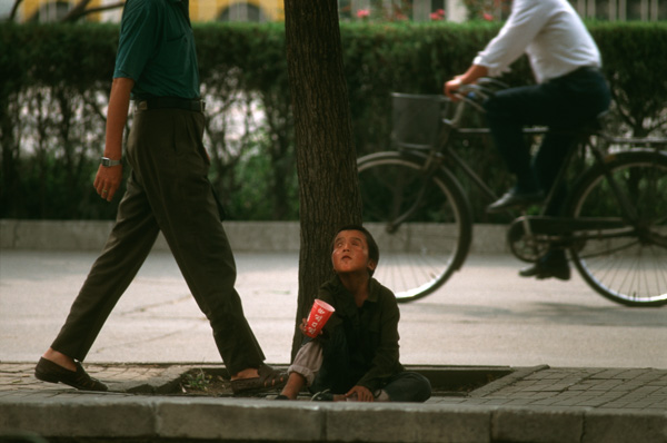 Blind child begging, Beijing