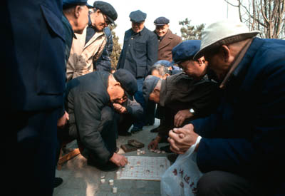 Men playing Chinese Chess