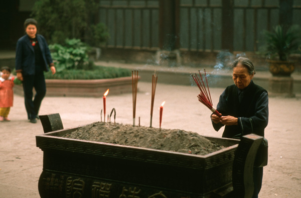 Burning incense, Buddhist temple, China