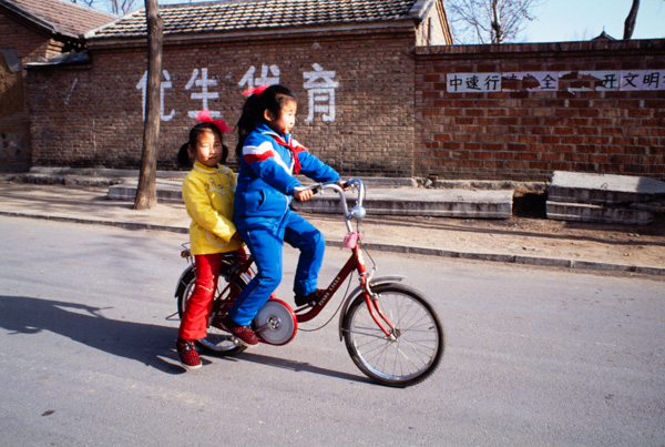 Sisters on bicycle, Beijing, China