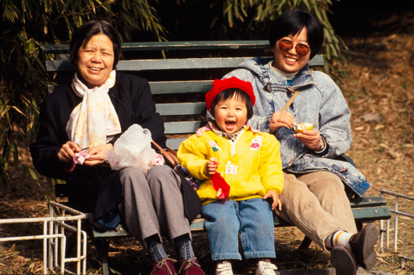 Child with mother and grandmother, Beijing, China