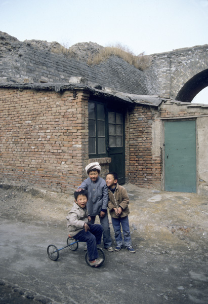 Children near old Beijing city wall