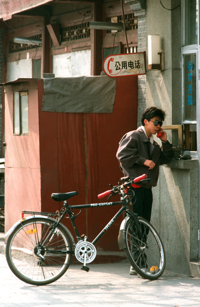 Man uses public telephone, Beijing