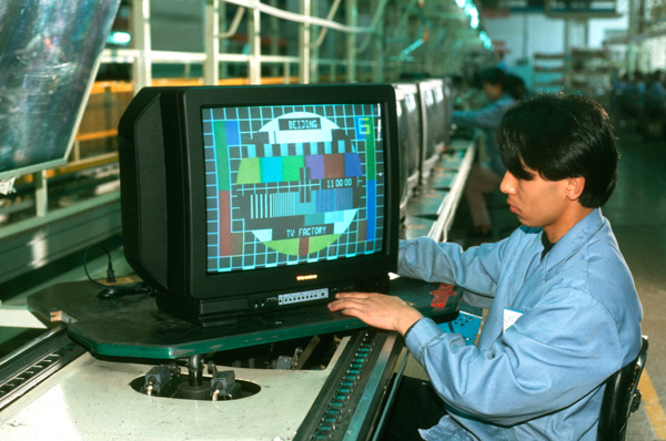 Worker in Beijing television factory