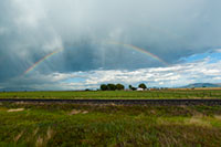 Rainbow over farmland, Colorado