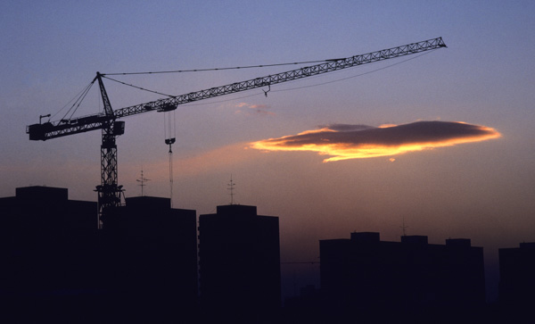 Construction crane and sunset