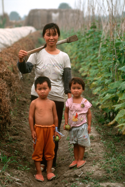 Woman, children, in field