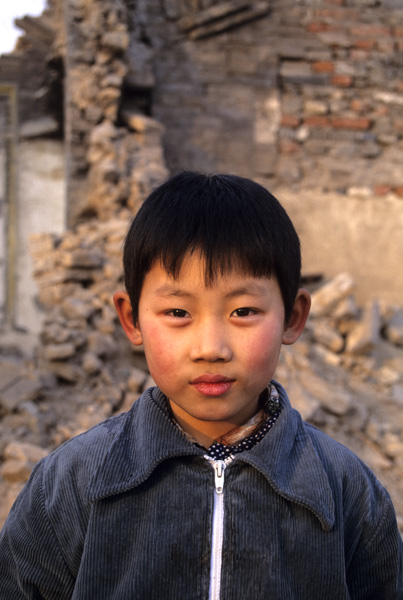 Child in demolishd neighborhood