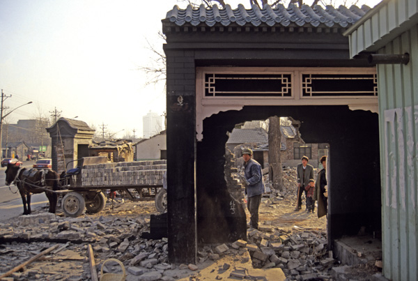 Workers tear down gate