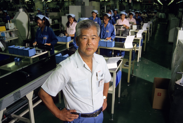 Japanese businessman in factory, Dalian, China
