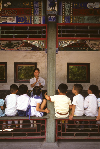 Teacher and children at kindergarten