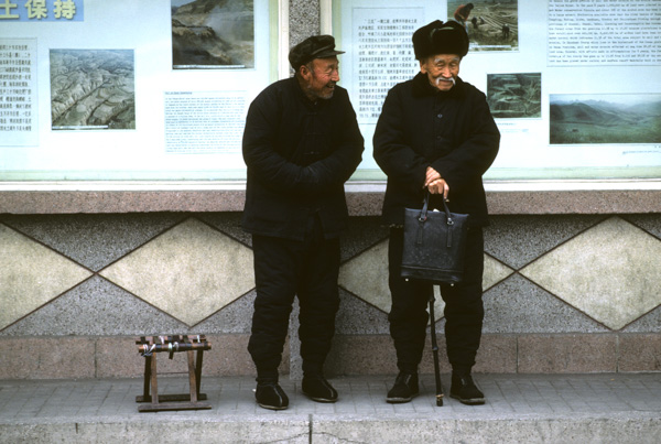 Men in black padded clothing, Beijing
