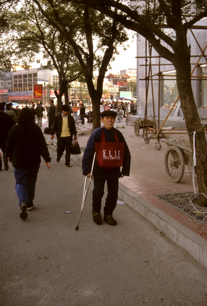 Man with crutch, Beijing