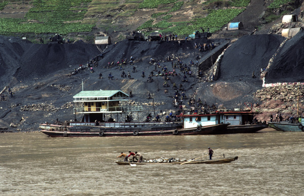 Workers load coal barge along Yangzi River