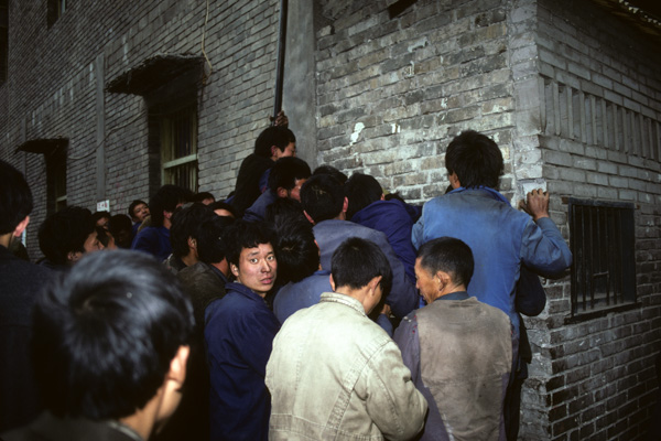 Workers waiting to collect pay
