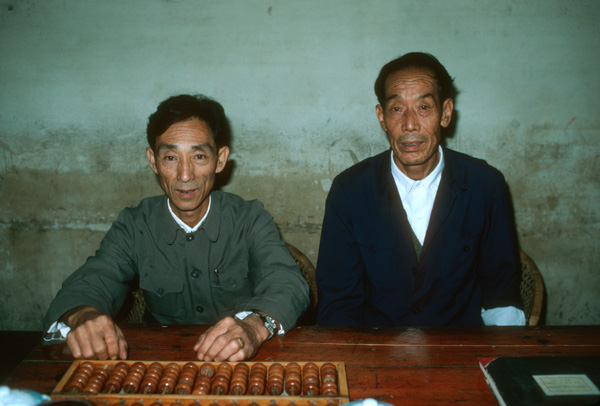 Men with abacus