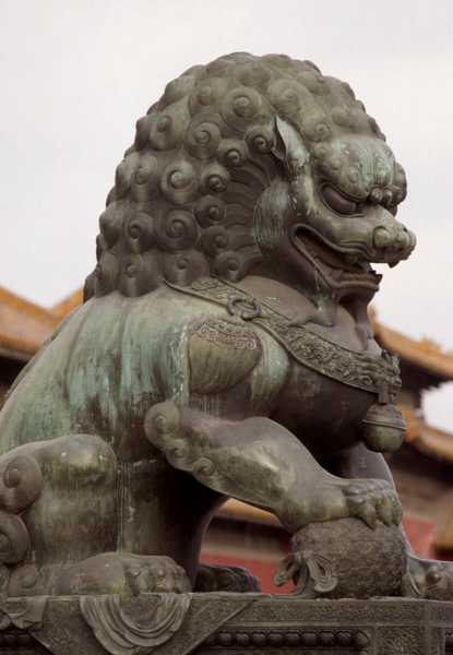 Pollution-streaked bronze lion