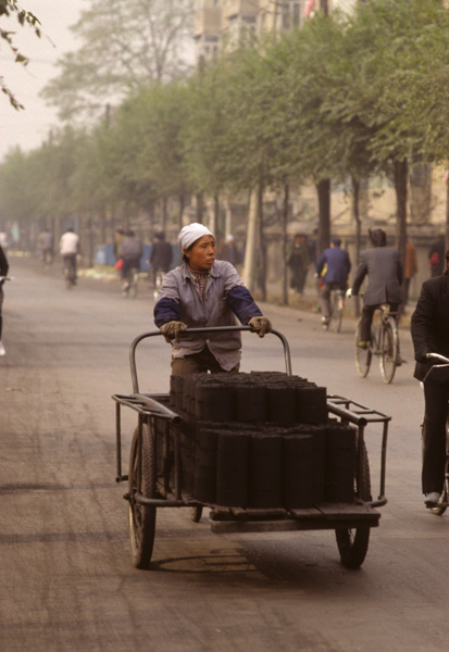 Worker hauls coal