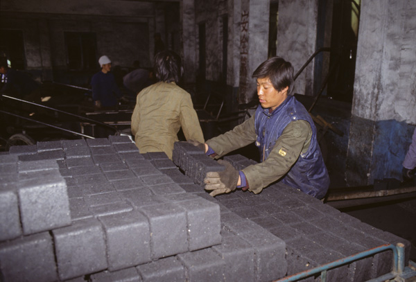 Man with coal briquettes, Shenyang