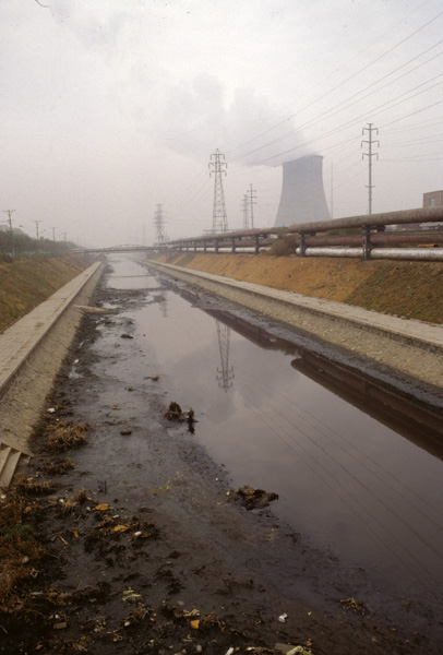 Polluted canal and cooling tower, Shenyang, China