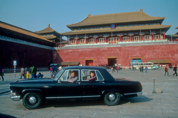 Posing for photos in a Hongqi Limo