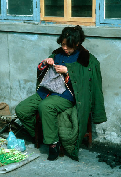 Woman knitting, Beijing