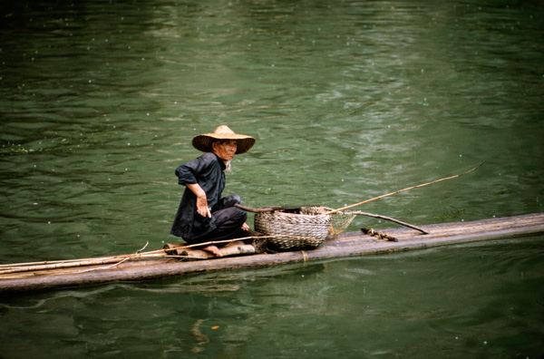 Man on raft, Li River near Guilin, China