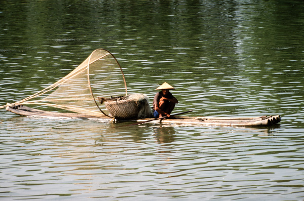 Man on raft, Li River near Guilin, China