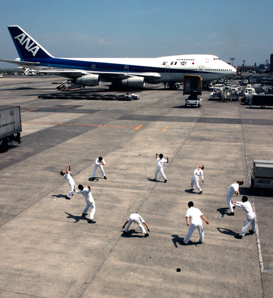 Employes doing pre-work calesthenics, Japan