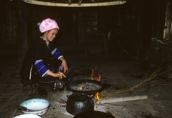 Minority woman cooking, Guangxi