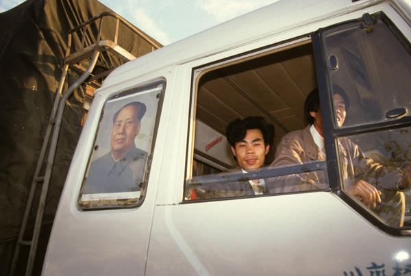 Mao portrait on back window of truck