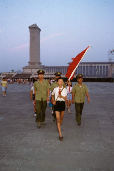 Martial law soldiers escort youth on Tiananmen Square