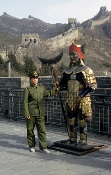 PLA soldier with statue on Great Wall