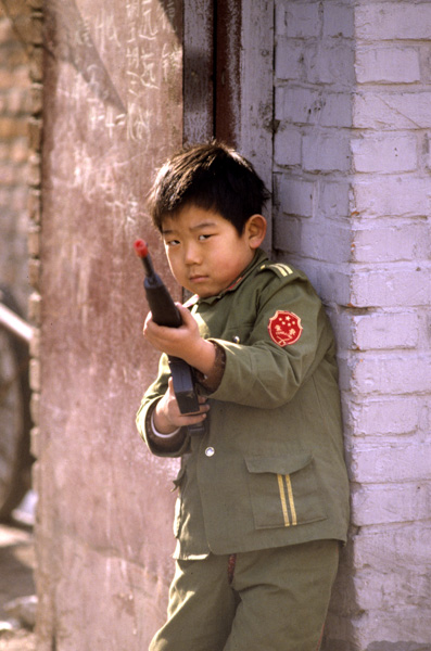 Child in mock PLA uniform