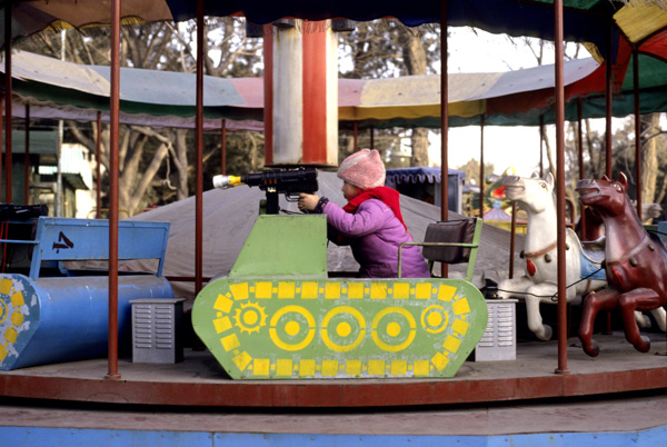 Child on tank ride at park