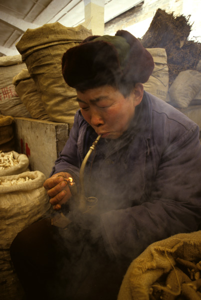 Man smoking traditonal pipe