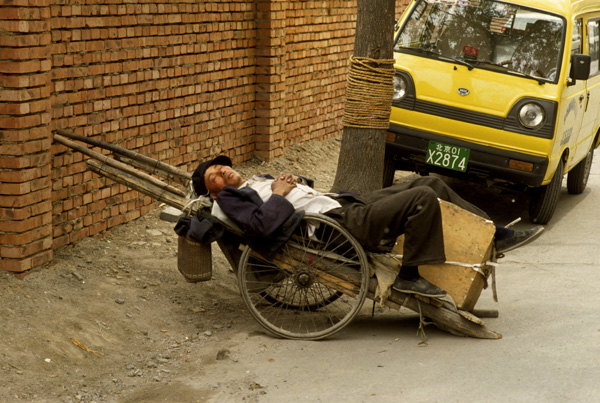 Man sleeps on cart, Beijing