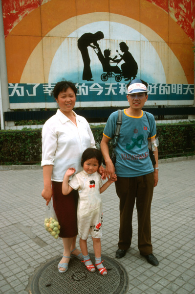 Family with one child and population poster