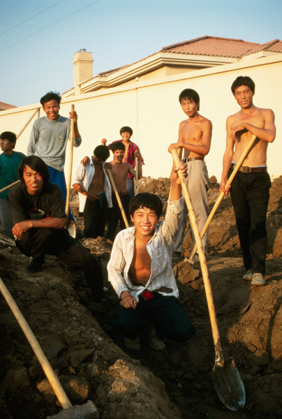 Construction workers building luxury villas, Beijing, China