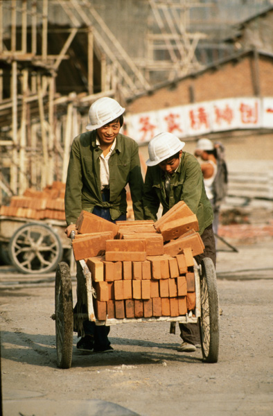 Workers with bricks, Beijing, China