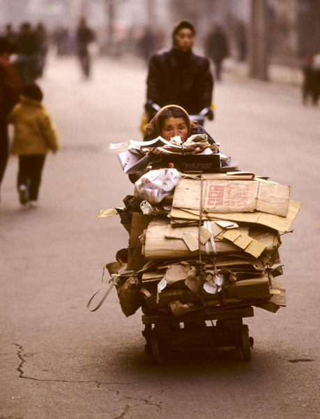 Woman with recycle cart