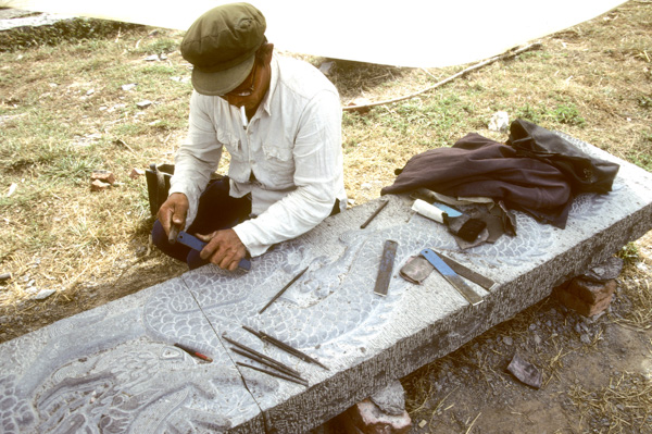 Stone carver carving dragon