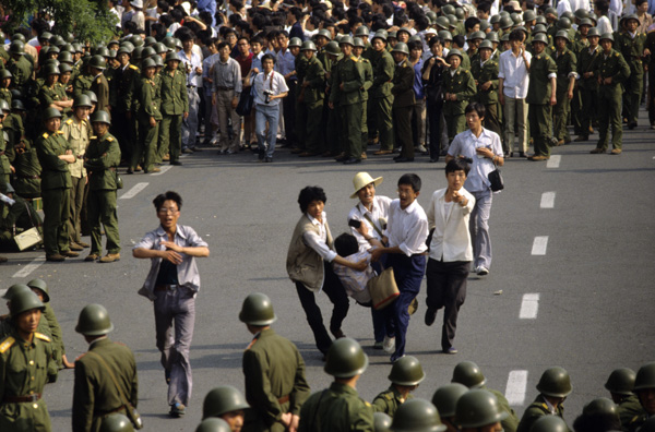 Protesters carry injured protester, Tiananmen