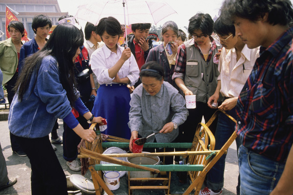 Woman dispense free soup