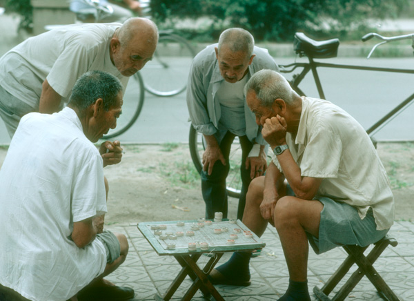 Men playing Chinese chess, Beijing, China