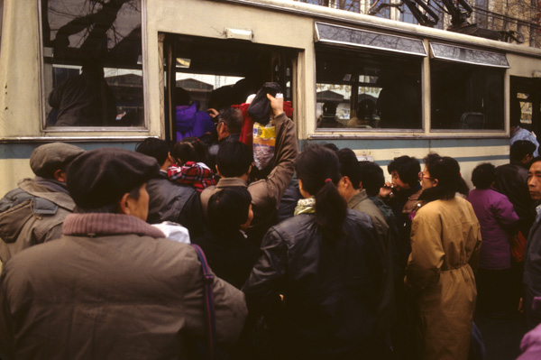 People getting on bus